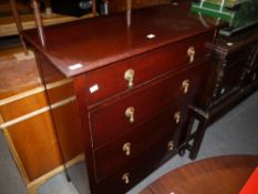 A stained oak chest of four graduated drawers