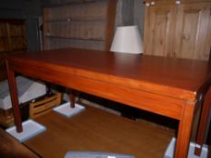 A rectangular dining table on square legs