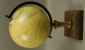 A reproduction globe on wooden stand