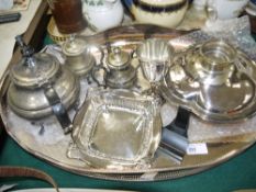 A plated on copper galleried two handle tray of oval outline together with a three piece EPNS tea