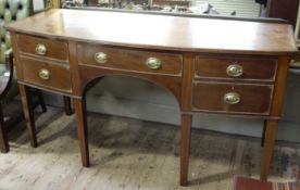 An early 20th century Georgian style mahogany bow front sideboard banded in satinwood with ebony