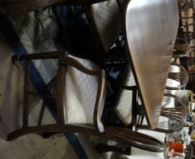 A mahogany and cross banded twin pedestal dining table with extra leaf,