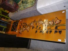 A tile top and stainless steel coffee table,