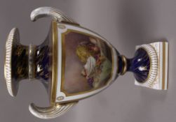 A Royal Worcester two handled vase of urn shape,