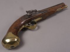 A pair of 19th century percussion pistols with walnut stocks and brass trigger guard