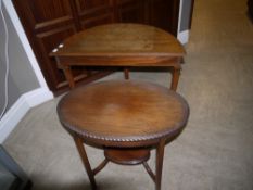An early 20th century mahogany oval window table with undertier together with a demi lune hall