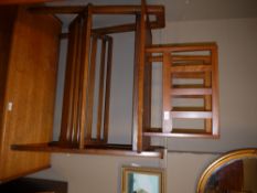 A 1950s oak table with magazine rack undertier on 'A' frame legs together with a small magazine