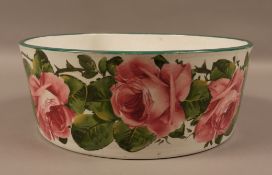 A Wemyss ware bowl, circular painted with a continuous band of roses, green rim line,