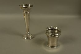 A silver specimen vase of tapered cylindrical outline, on weighted base, 20.
