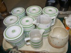 A set of Evergreen pottery green and white banded storage jars and two measuring jugs, eight pieces,