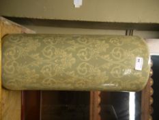 A reproduction umbrella tile of pale green and ivory