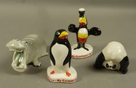 Two small Guinness figures in the form of a penguin and a toucan,