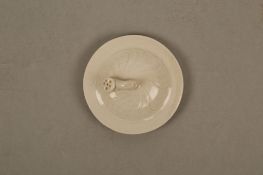 A CHINESE DINGYAO ‘LOTUS’ JAR AND COVER. Song Dynasty. The globular body supported on a tapering