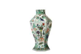 A CHINESE FAMILLE VERTE HEXAGONAL VASE. Qing Dynasty, Kangxi period. Of hexagonal baluster form,