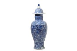 A CHINESE BLUE AND WHITE VASE AND COVER. Qing Dynasty Kangxi period. The tapered ovoid body