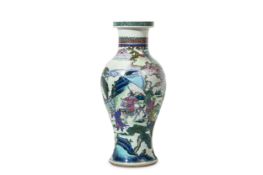 A CHINESE LATER-ENAMELLED BLUE AND WHITE VASE. Qing Dynasty, Kangxi period. The ovoid body rising