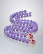 An Exceptional Strand Lavender Jadeite Bead Necklace