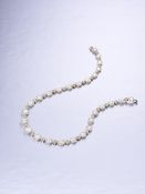 A Fine Diamond and Coloured Diamond Rivière Necklace, by La Serlas