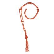 NO RESERVE - AN ANTIQUE CORAL TASSEL NECKLACE the necklace comprising twisted rows of coral beads,