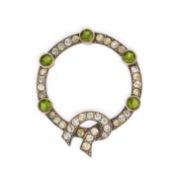 NO RESERVE - AN ANTIQUE PASTE KNOT BROOCH in silver, designed as a ribbon tied with a knot, set with