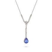 NO RESERVE - A TANZANITE AND DIAMOND PENDANT NECKLACE in 18ct white gold, comprising a trace