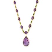 NO RESERVE - AN AMETHYST AND TSAVORITE PENDANT NECKLACE in silver gilt, the pendant set with a large