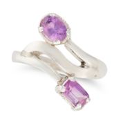 NO RESERVE - A PINK SAPPHIRE CROSSOVER RING set at each end with a rectangular step cut sapphire