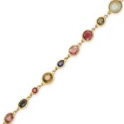 NO RESERVE - A VINTAGE MULTI GEM HARLEQUIN BRACELET in yellow gold, set with a cabochon cat's eye