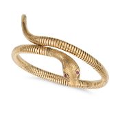 NO RESERVE - A VINTAGE RUBY SNAKE BANGLE, 1965 in 9ct yellow gold and steel, designed as a coiled